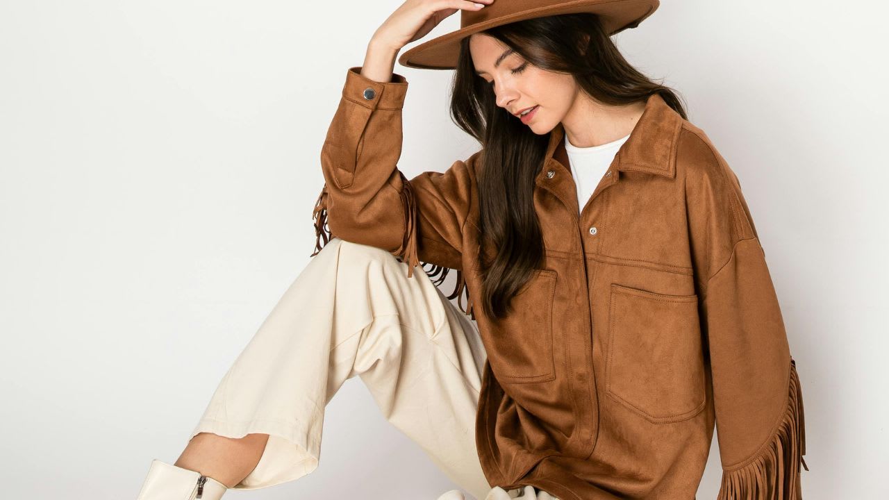 Fashionable Woman in Bohemian Outfit Sitting Pose